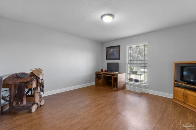 a view of a livingroom with furniture and wooden floor