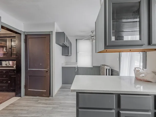 a kitchen with a refrigerator and countertop