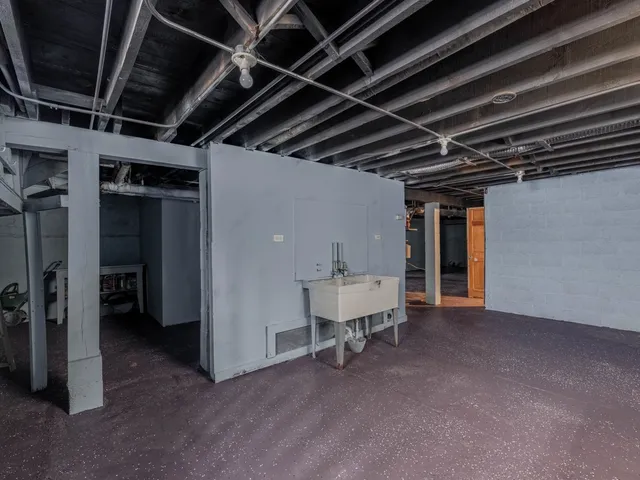 a view of an empty room with a fireplace