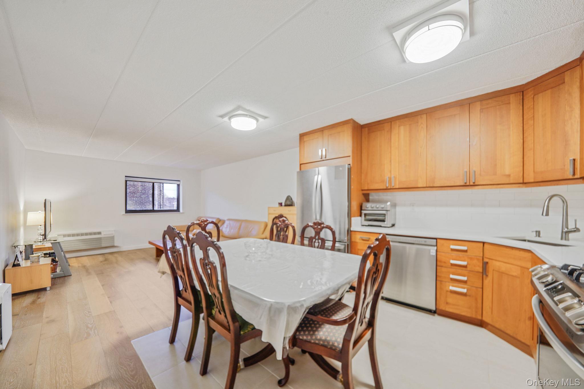 213-02 42nd Avenue, Unit 2A Queens, NY 11361 - Photo 6 of 24 a dining room with furniture and window