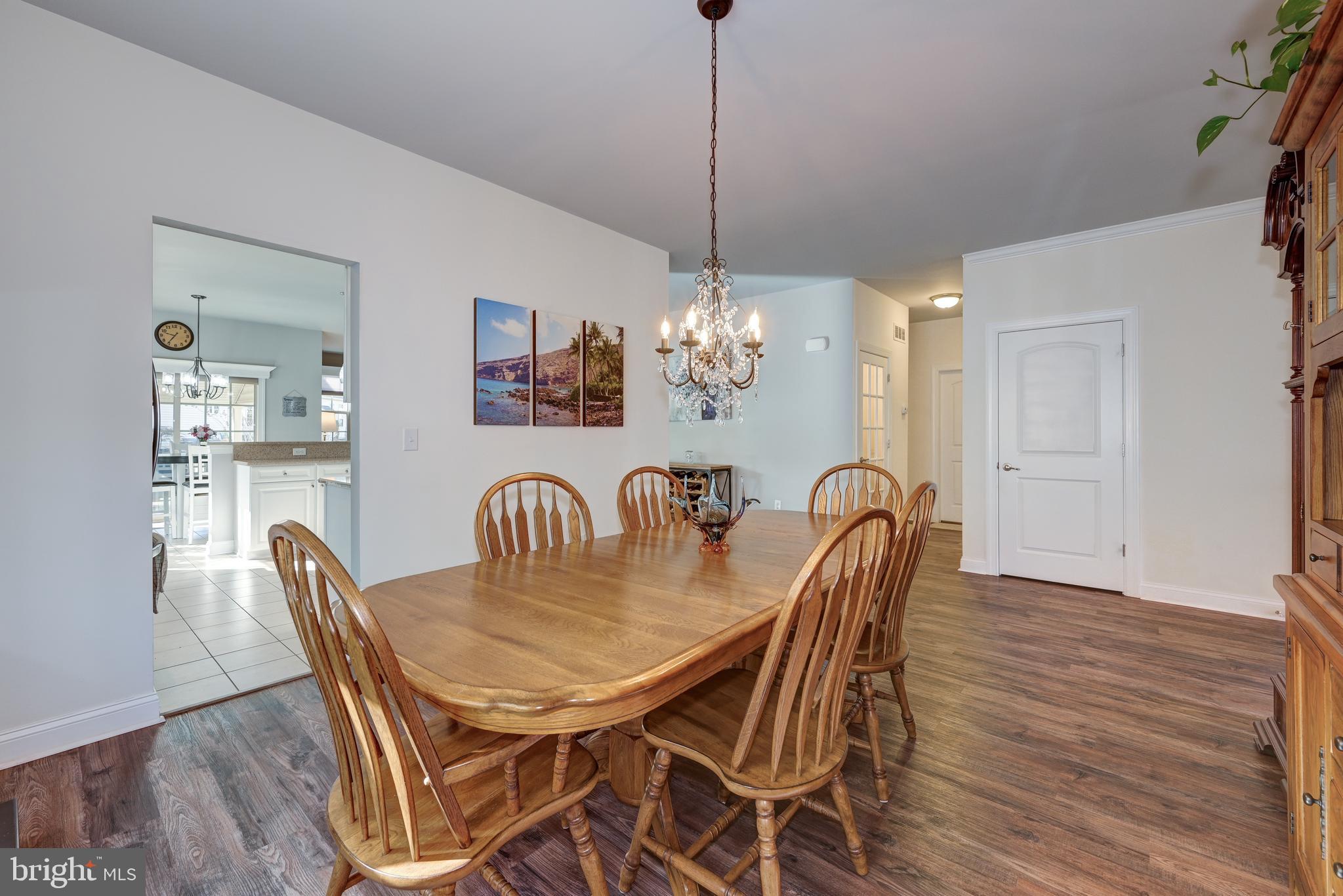18 Genova Drive West Berlin, NJ 08091 - Photo 11 of 49 a dining room with furniture a chandelier and wooden floor