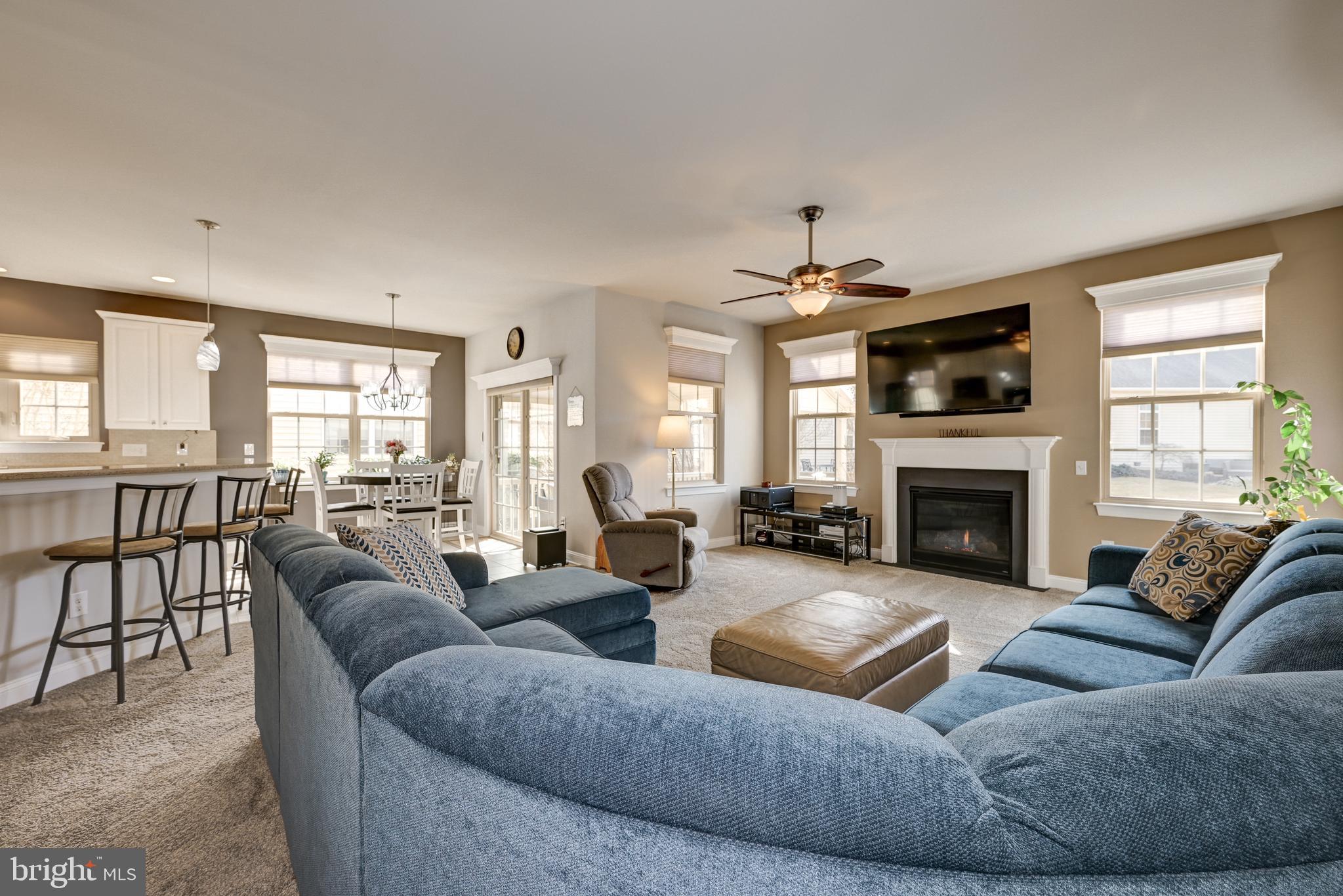 18 Genova Drive West Berlin, NJ 08091 - Photo 26 of 49 a living room with fireplace furniture and a large window