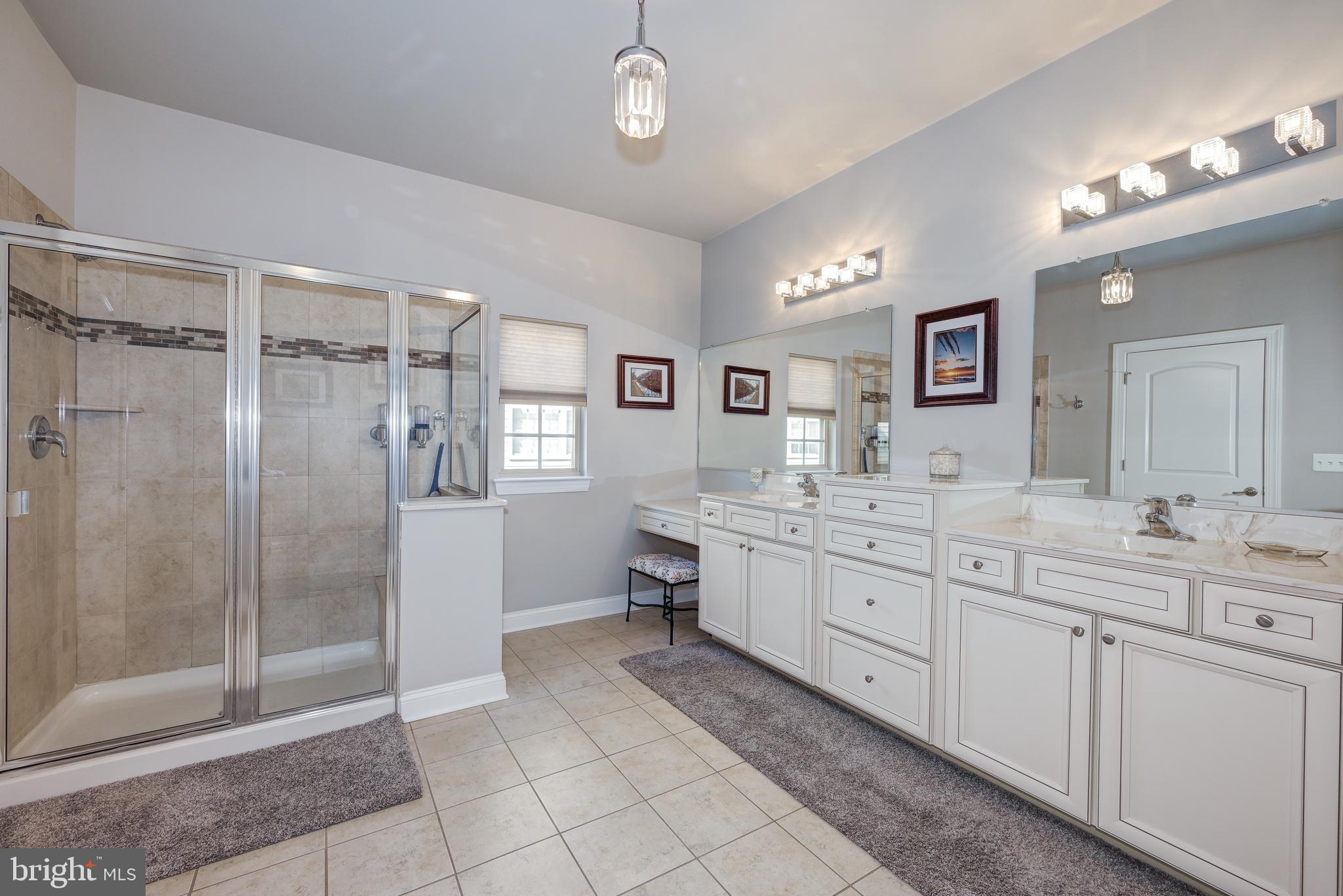 18 Genova Drive West Berlin, NJ 08091 - Photo 30 of 49 a spacious bathroom with a shower a sink and mirror
