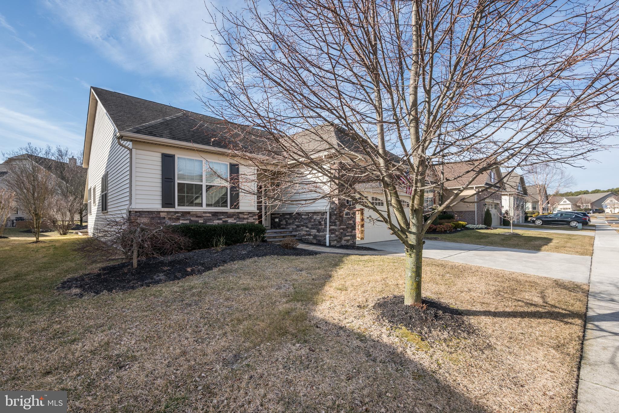 18 Genova Drive West Berlin, NJ 08091 - Photo 3 of 49 a view of a yard with plants and trees