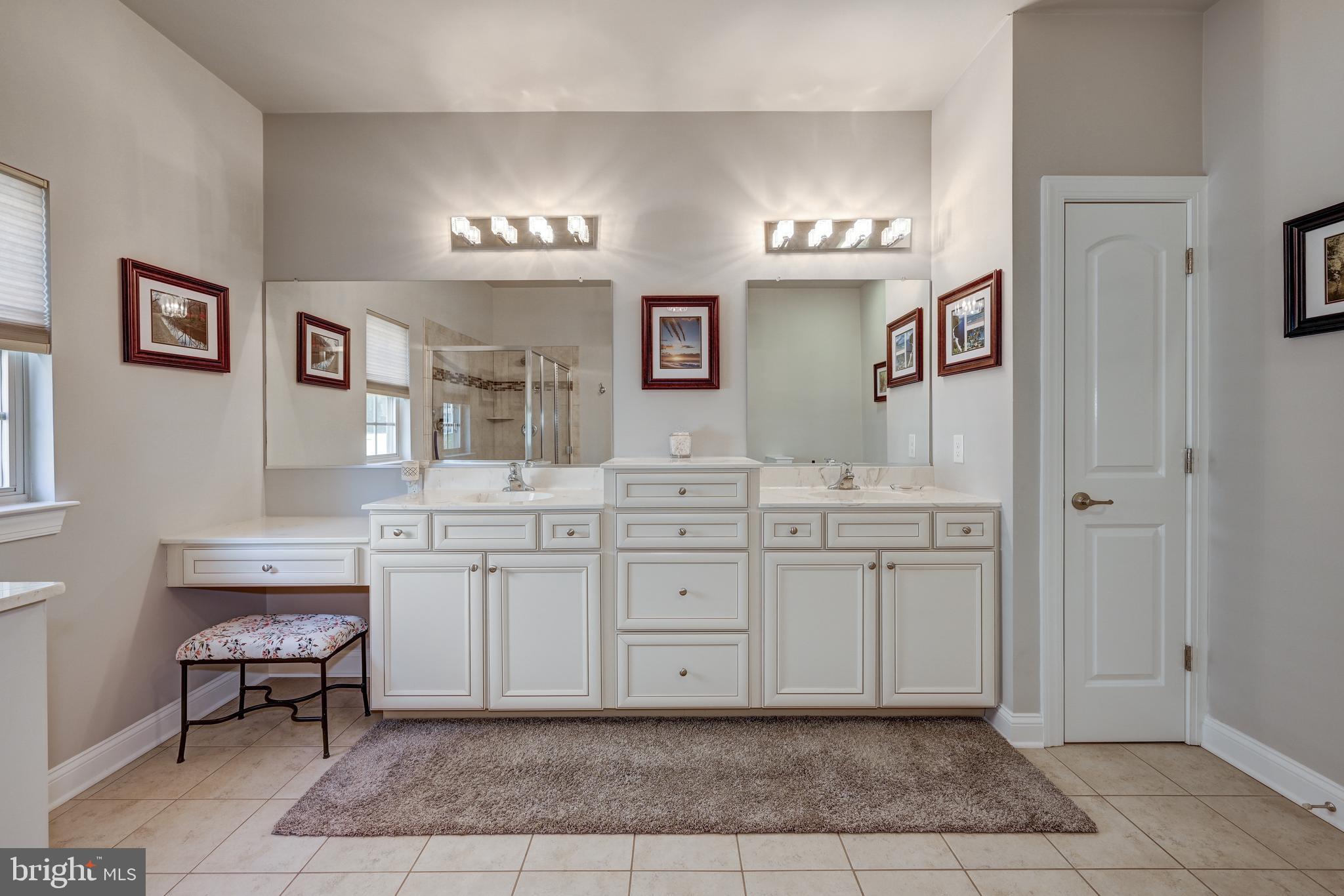 18 Genova Drive West Berlin, NJ 08091 - Photo 31 of 49 a spacious bathroom with a granite countertop sink a mirror and a