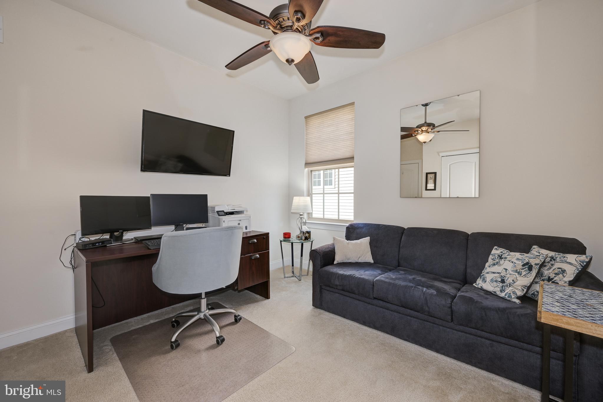 18 Genova Drive West Berlin, NJ 08091 - Photo 34 of 49 a living room with furniture and a flat screen tv