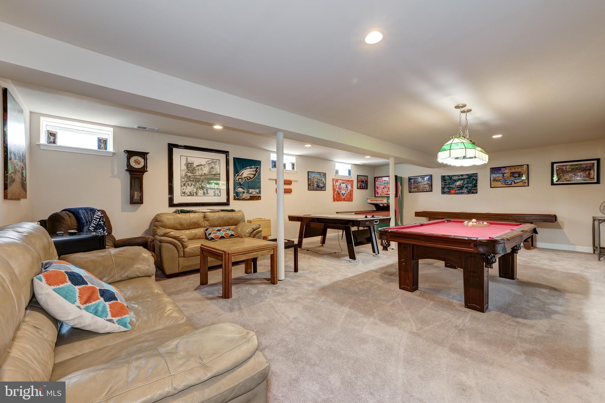 18 Genova Drive West Berlin, NJ 08091 - Photo 37 of 49 a living room with furniture a table and a chandelier