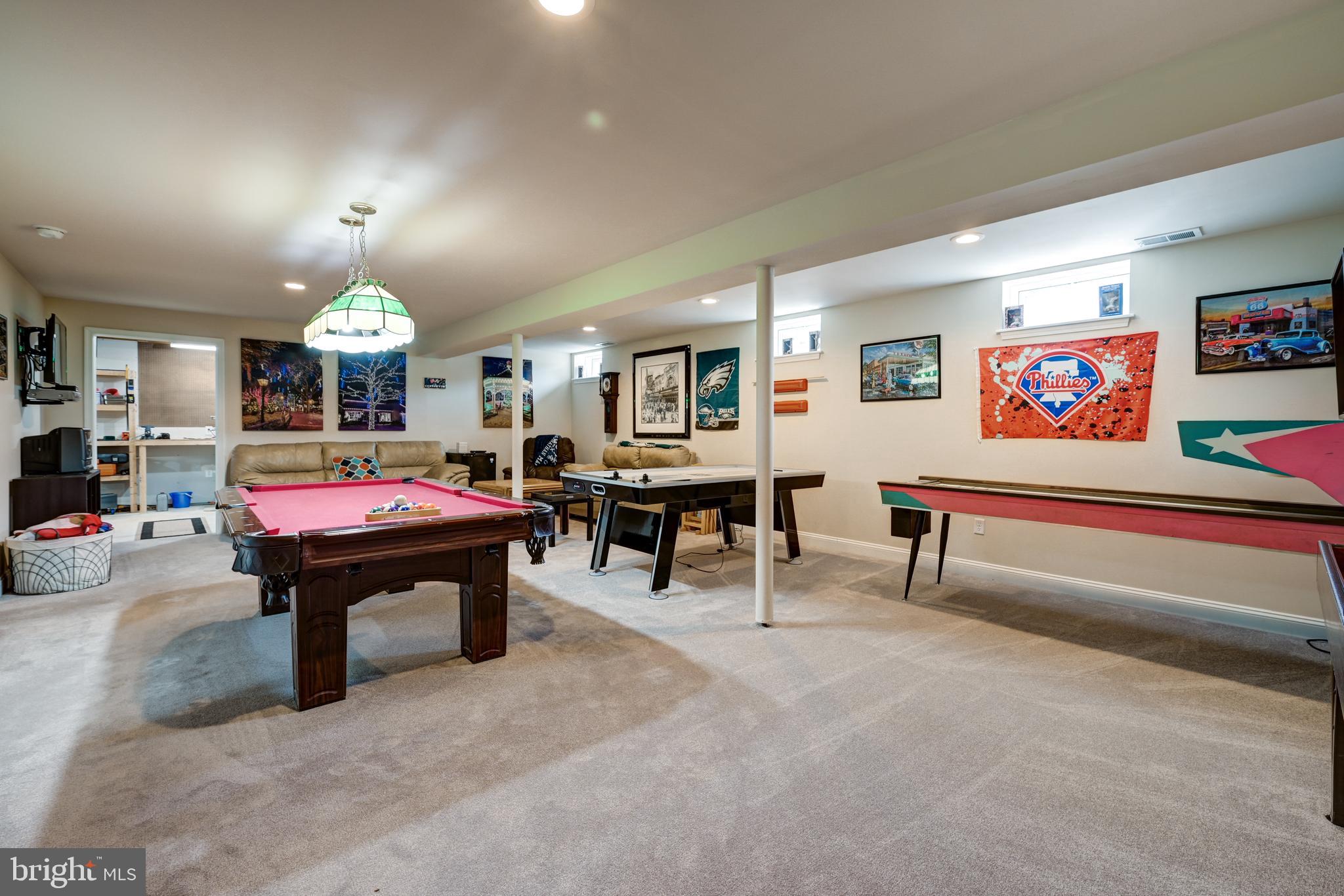 18 Genova Drive West Berlin, NJ 08091 - Photo 38 of 49 a living room with furniture and a chandelier