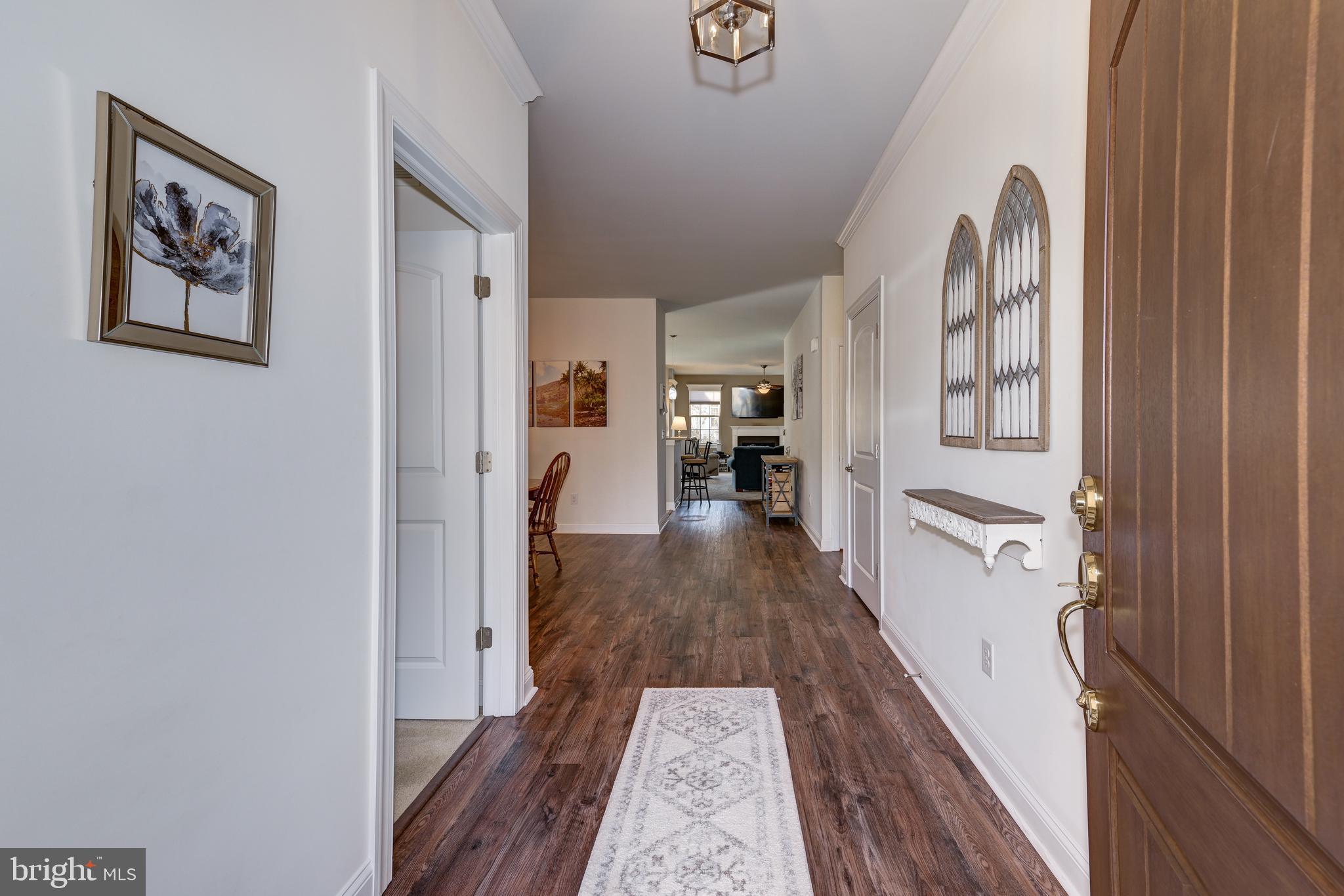 18 Genova Drive West Berlin, NJ 08091 - Photo 6 of 49 a view of a hallway with wooden floor and staircase