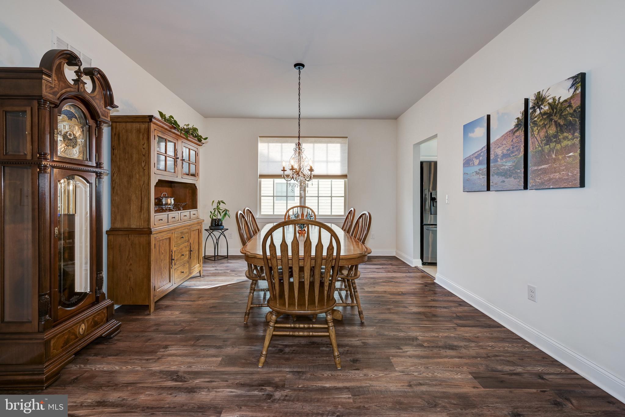 18 Genova Drive West Berlin, NJ 08091 - Photo 8 of 49 a view of a dining room with furniture window and wooden floor