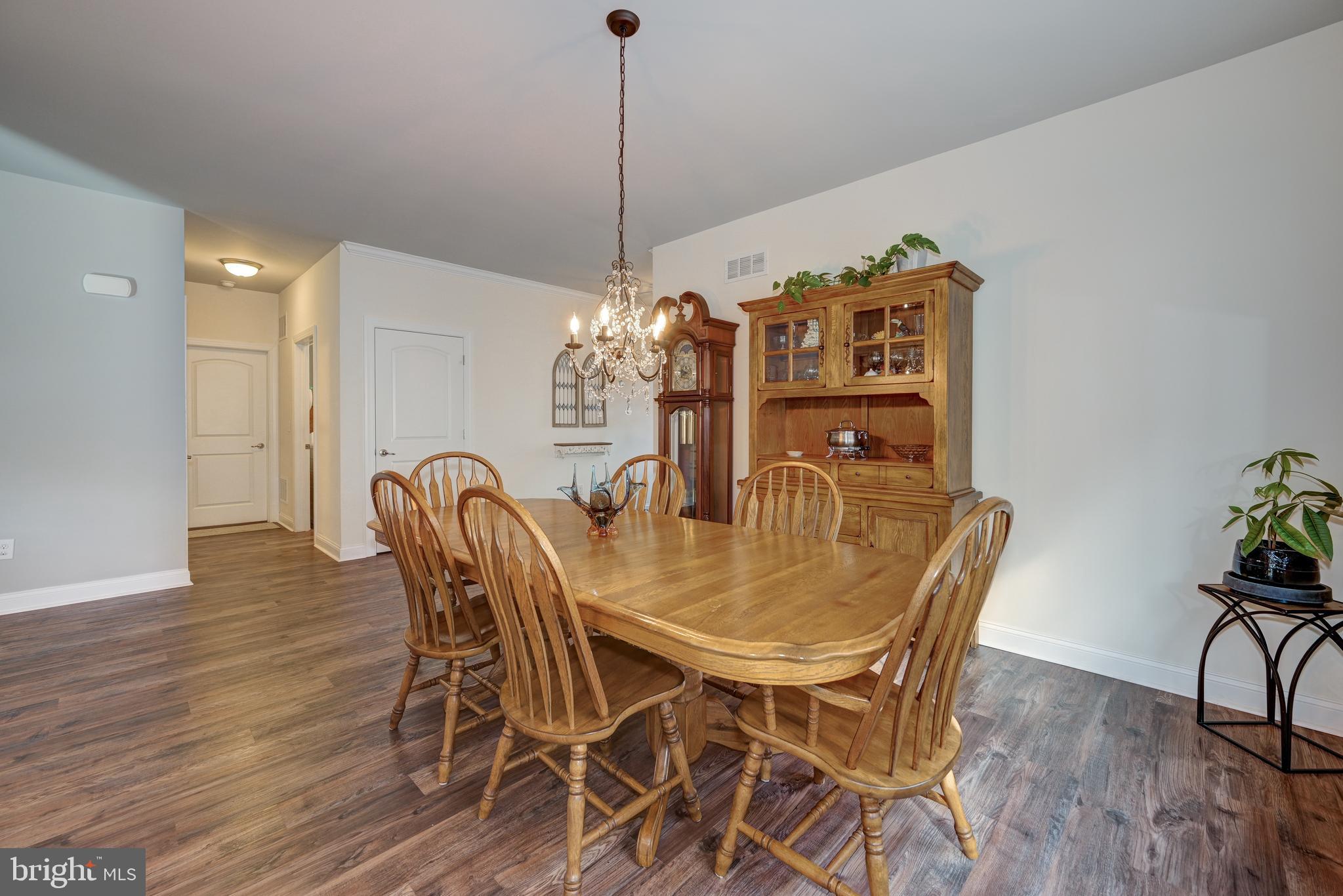 18 Genova Drive West Berlin, NJ 08091 - Photo 10 of 49 a view of a dining room with furniture and wooden floor