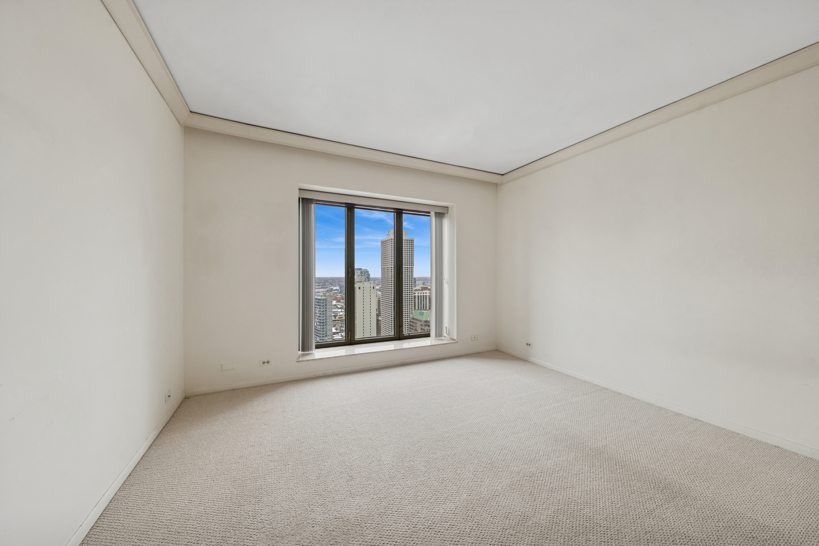 950 North Michigan Avenue, Unit 3104 Chicago, IL 60611 - Photo 22 of 28 a view of an empty room with a window