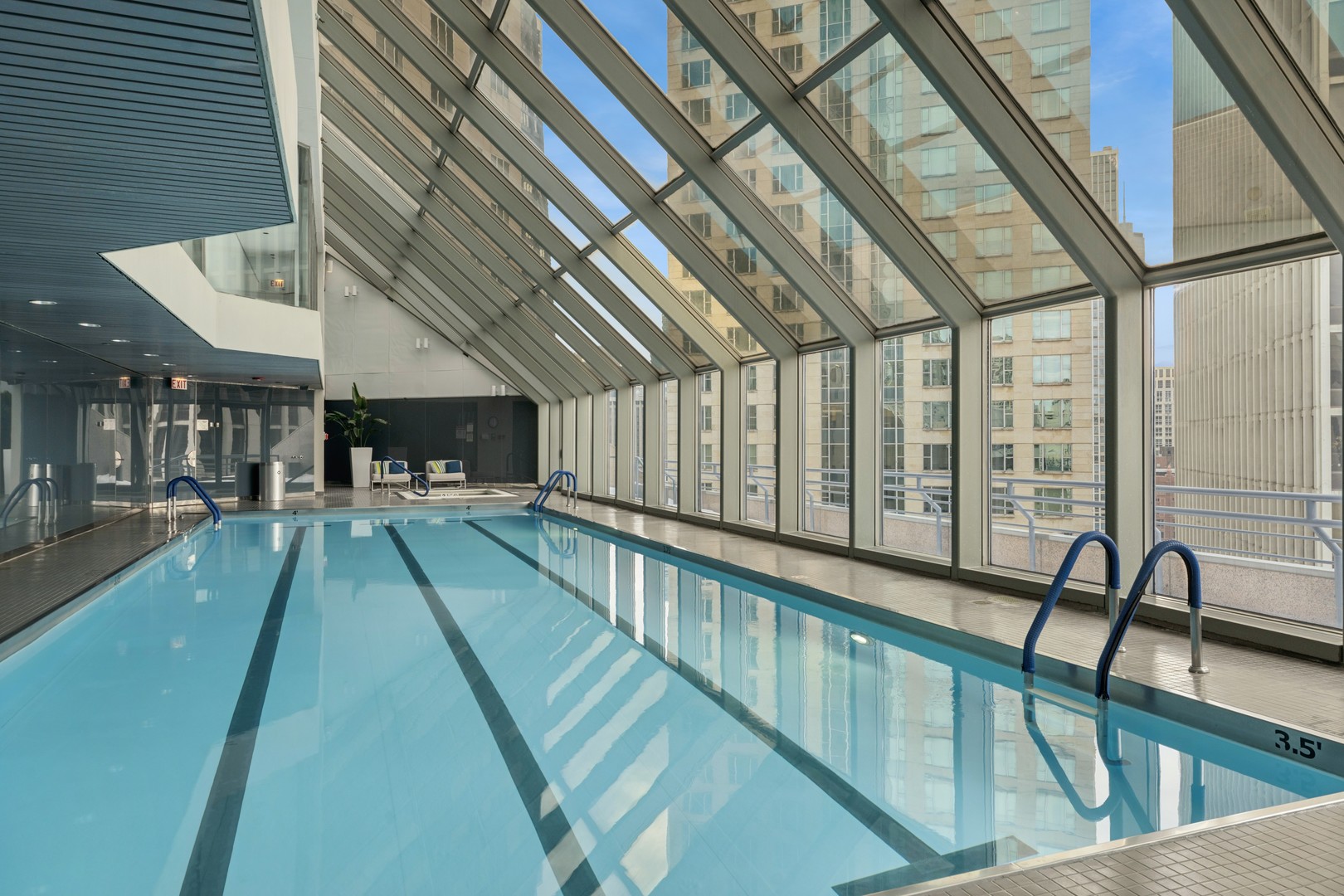 950 North Michigan Avenue, Unit 3104 Chicago, IL 60611 - Photo 26 of 28 a view of swimming pool with a large window and furniture
