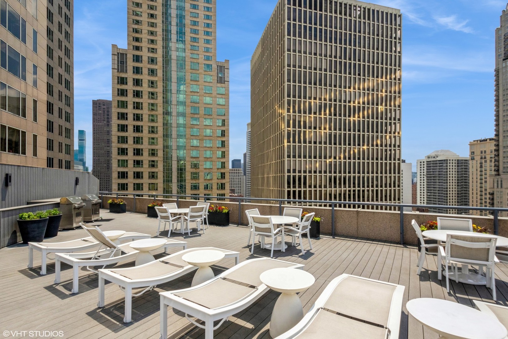 950 North Michigan Avenue, Unit 3104 Chicago, IL 60611 - Photo 27 of 28 a view of a balcony with chairs and tables