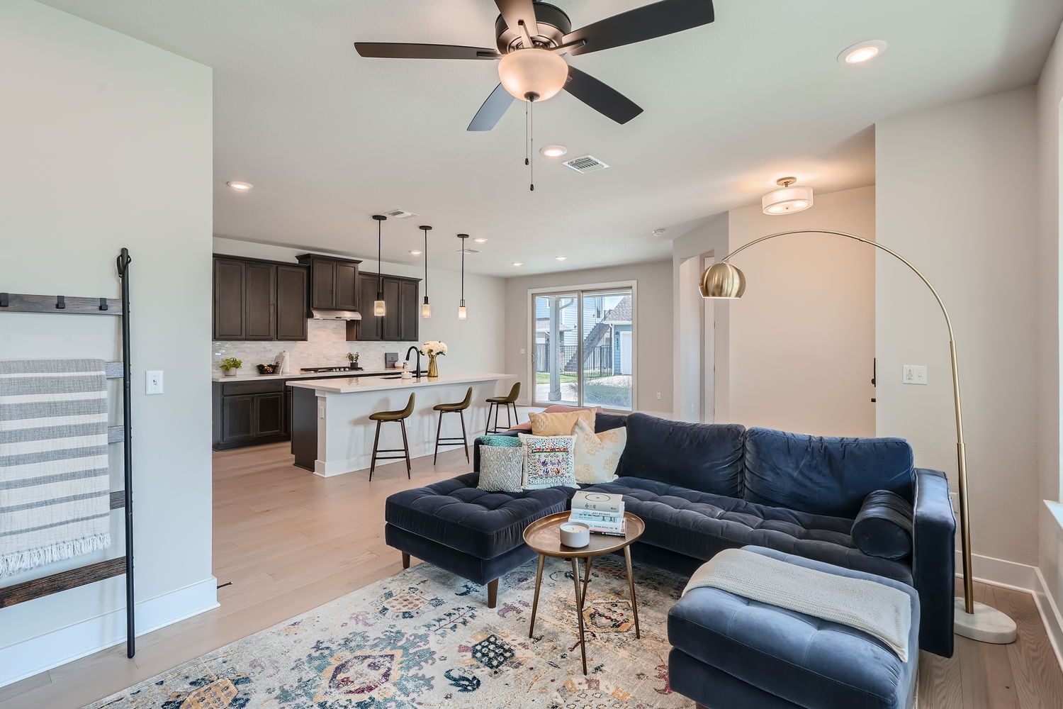 8319 Laughlin Lane Austin, TX 78744 - Photo 3 of 26 Upon entering, you'll be greeted by beautiful light wood floors that flow through the open-concept living areas, where large windows fill the space in natural light.