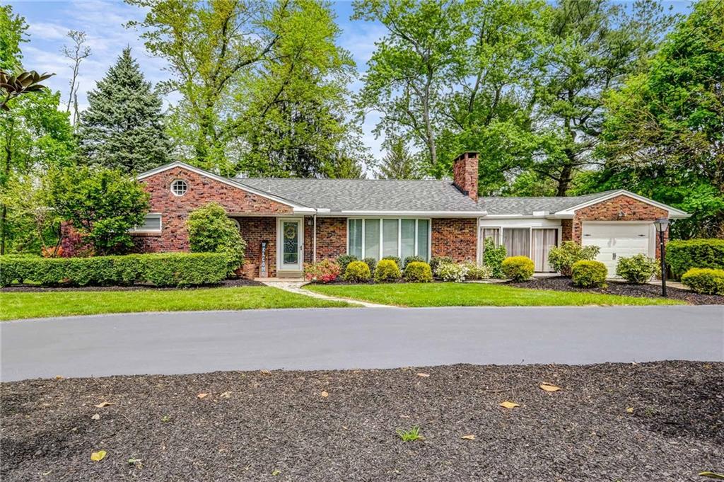 Beautiful solid brick home with circular drive on 1.1. acres!