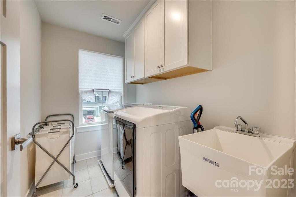7102 Messina Road Indian Land, SC 29707 - Photo 26 of 38 a utility room with dryer and washer