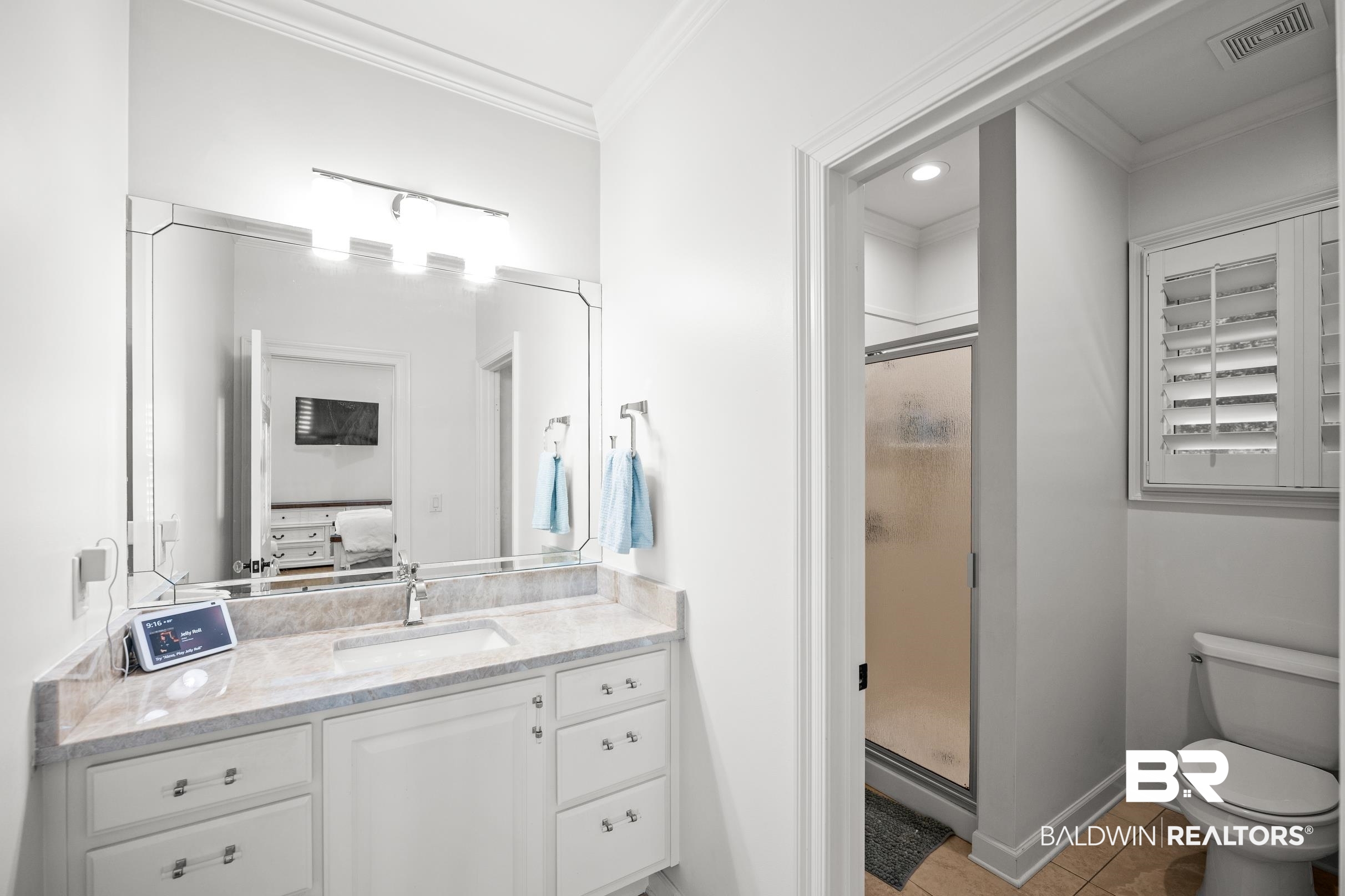 115 Sandy Ford Road Fairhope, AL 36532 - Photo 36 of 47 Full bath featuring vanity, a shower stall, ornamental molding, ensuite bath, and tile patterned flooring