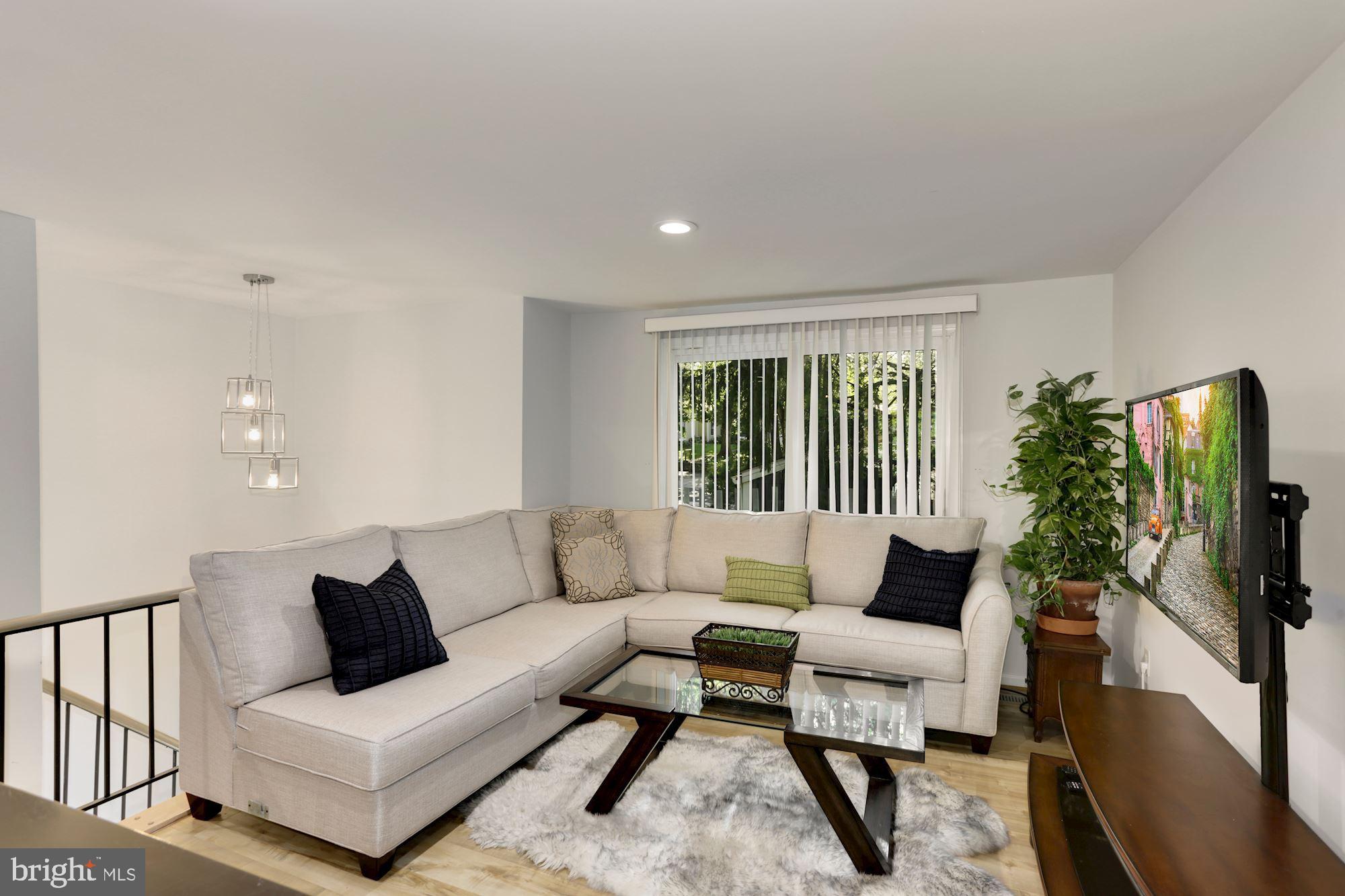 12264 Turkey Wing Court Reston, VA 20191 - Photo 4 of 33 Family room with tones of natural light