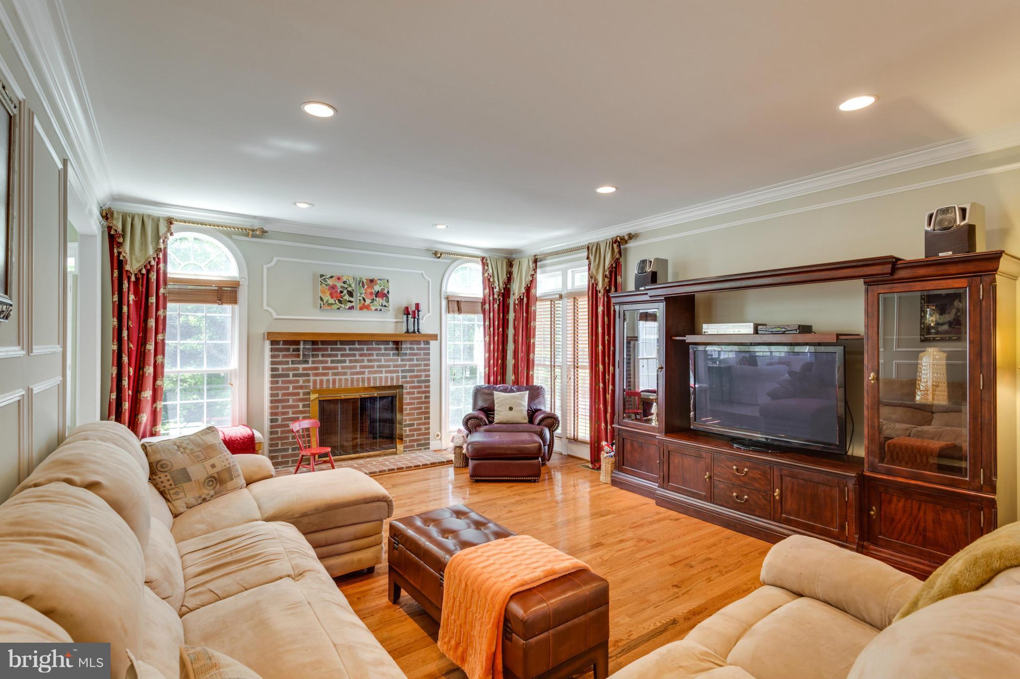 2754 Cody Road Vienna, VA 22181 - Photo 9 of 30 Family Room Gas Fireplace and Hardwood Floor