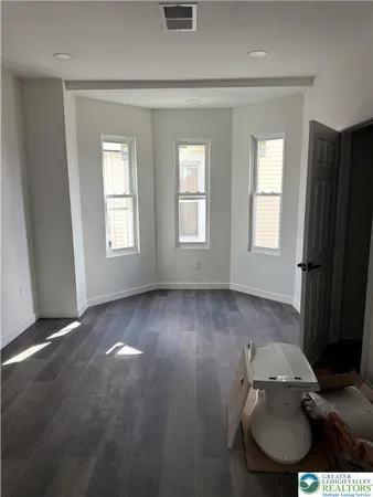 an empty room with windows