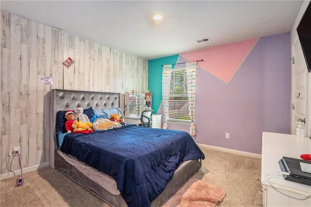 a bed room with a bed and a couch