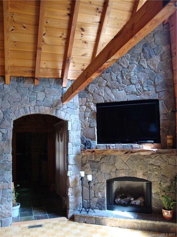 720 Potneck Road, Unit 1517 Salisbury, NC 28147 - Photo 15 of 24 a living room with a fireplace a flat screen tv and a fireplace