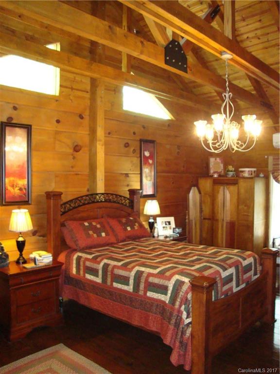 720 Potneck Road, Unit 1517 Salisbury, NC 28147 - Photo 17 of 24 a bedroom with a bed and a chandelier