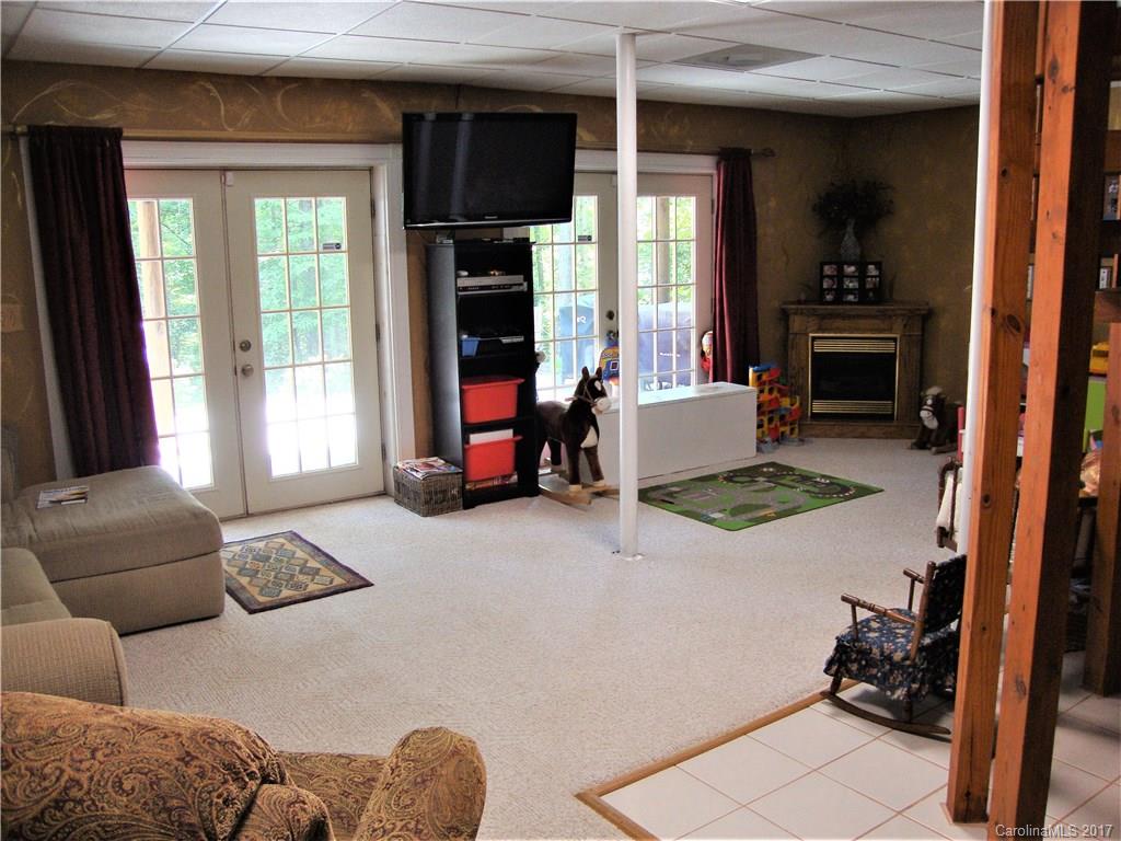 720 Potneck Road, Unit 1517 Salisbury, NC 28147 - Photo 22 of 24 a living room with furniture and a fireplace