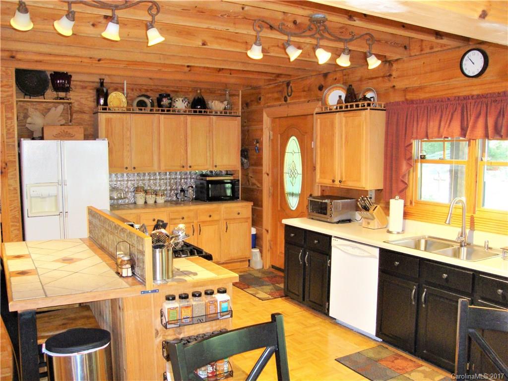 720 Potneck Road, Unit 1517 Salisbury, NC 28147 - Photo 8 of 24 a kitchen with a sink a stove and cabinets