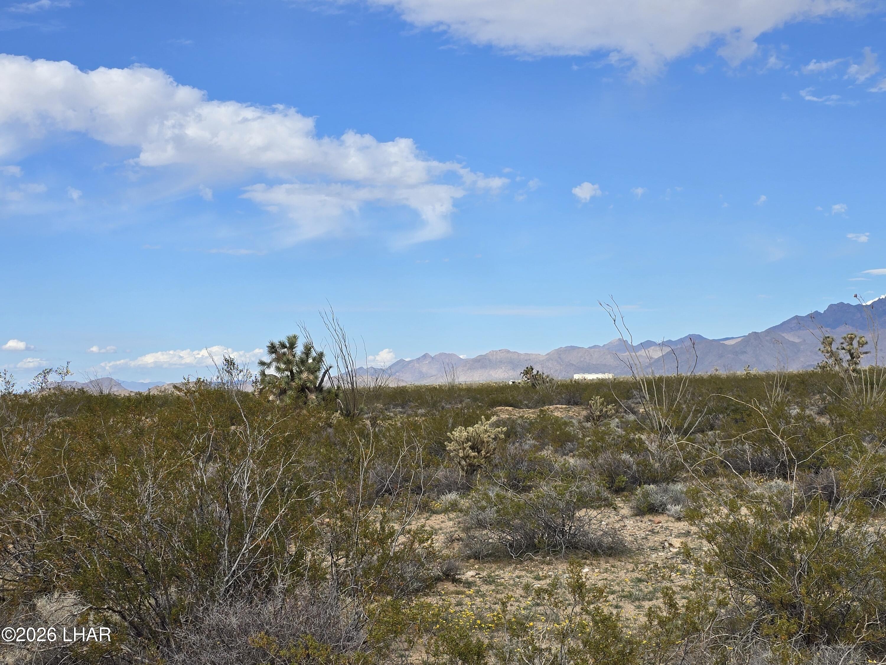 3412 South Lone Ranger Road Yucca, AZ 86438 - Photo 14 of 18 a view of an lake and mountain