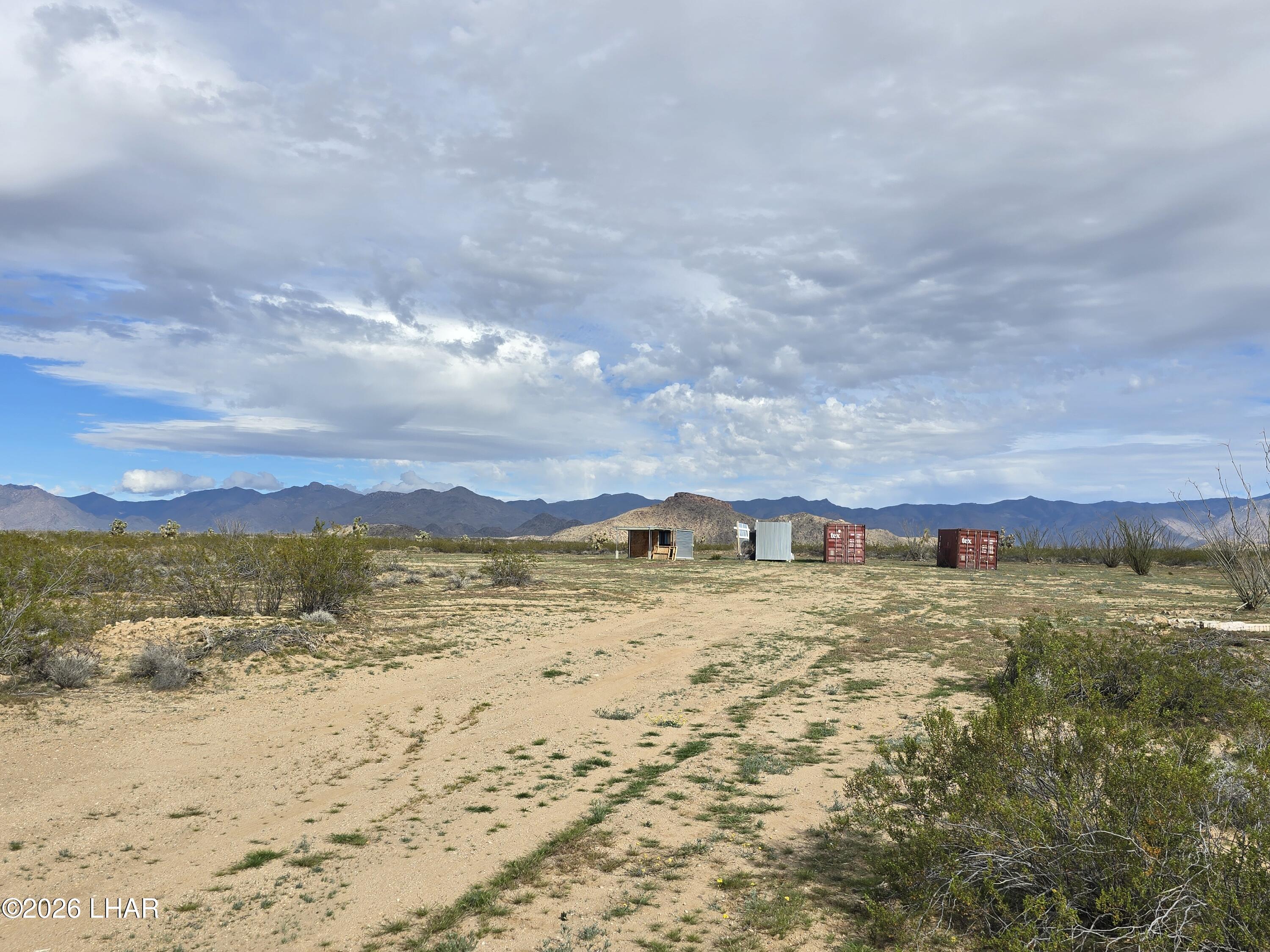 3412 South Lone Ranger Road Yucca, AZ 86438 - Photo 3 of 18 a view of an ocean beach and mountain