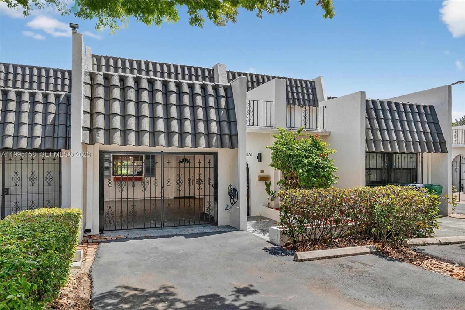 6161 Southwest 90th Court, Unit G2 Miami, FL 33173 - Photo 2 of 47 a front view of a house