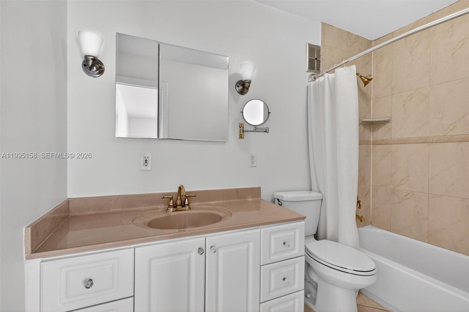 6161 Southwest 90th Court, Unit G2 Miami, FL 33173 - Photo 28 of 47 a bathroom with a sink toilet a mirror and shower