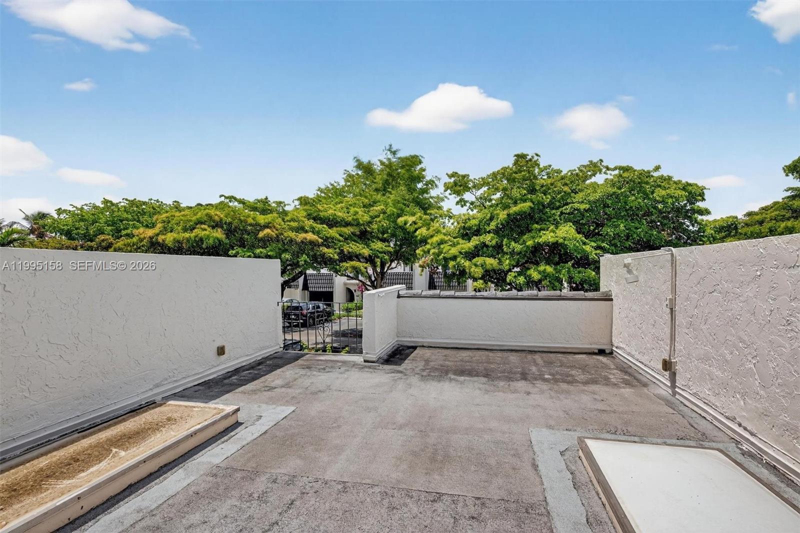 6161 Southwest 90th Court, Unit G2 Miami, FL 33173 - Photo 30 of 47 a view of outdoor space and deck