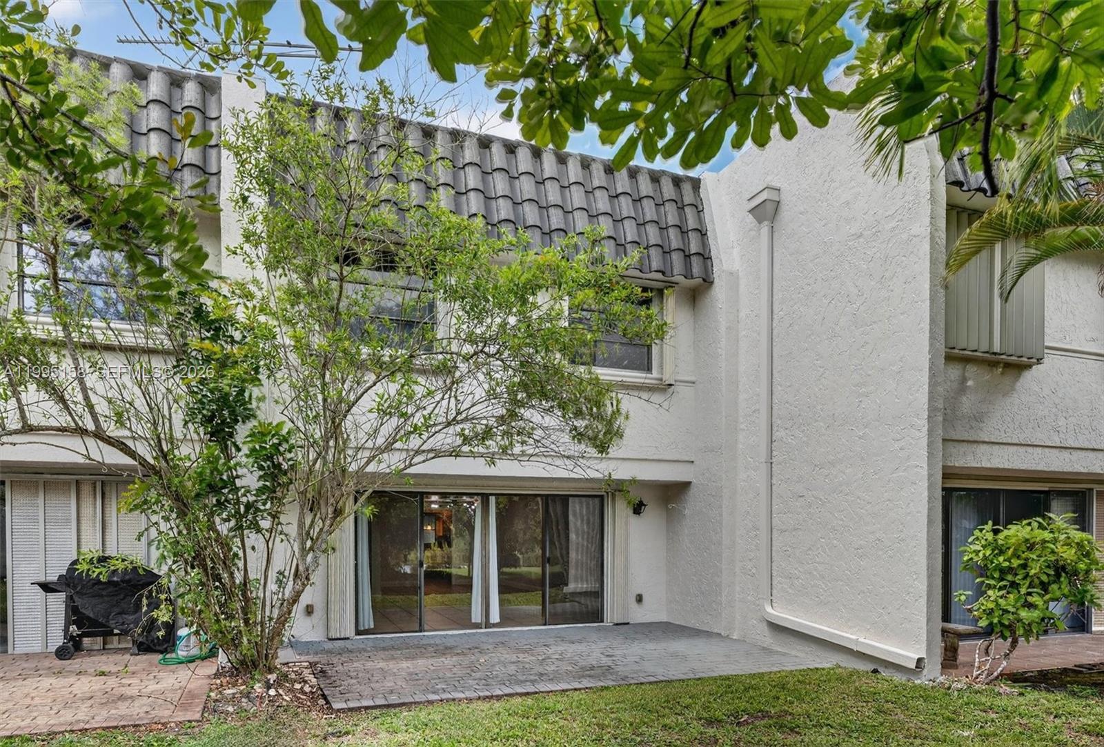 6161 Southwest 90th Court, Unit G2 Miami, FL 33173 - Photo 36 of 47 a front view of a house with garden