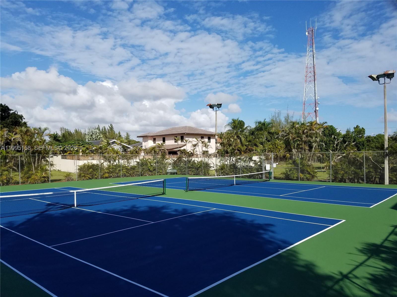 6161 Southwest 90th Court, Unit G2 Miami, FL 33173 - Photo 45 of 47 a view of an outdoor space and tennis court