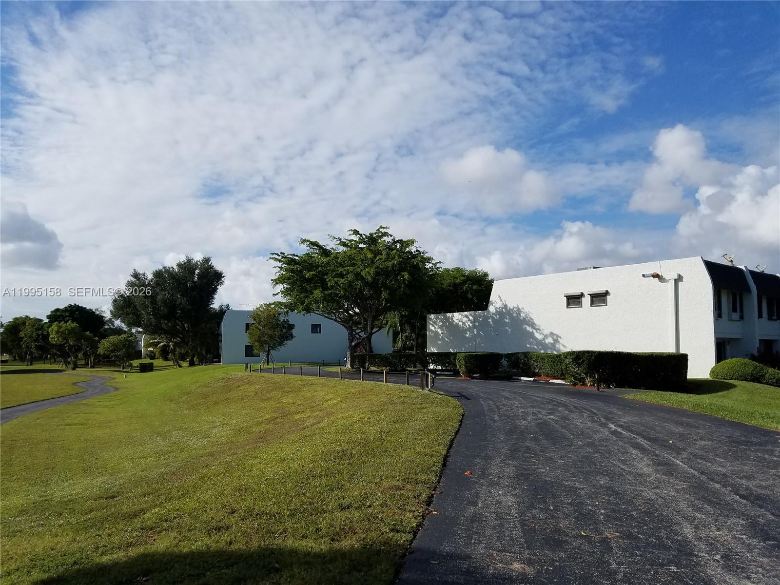 6161 Southwest 90th Court, Unit G2 Miami, FL 33173 - Photo 46 of 47 a view of a house with a yard