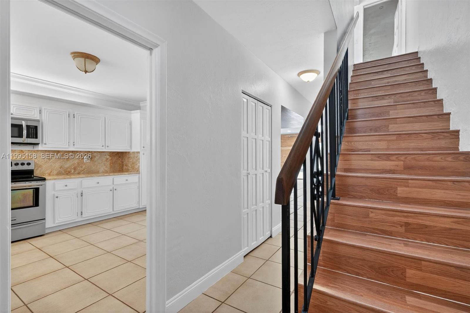 6161 Southwest 90th Court, Unit G2 Miami, FL 33173 - Photo 5 of 47 a view of entryway and kitchen