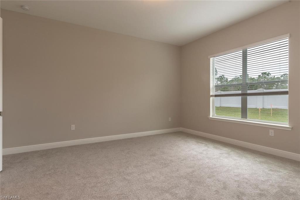 3509 Pilot Circle Naples, FL 34120 - Photo 15 of 32 an empty room with a window