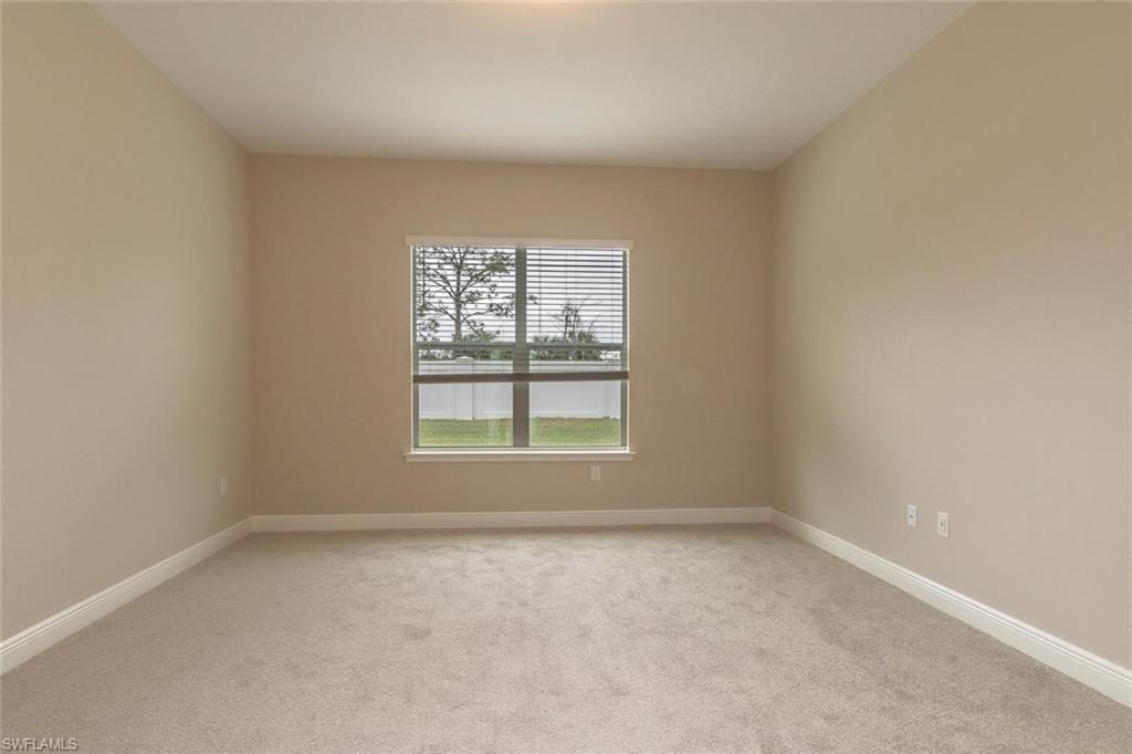 3509 Pilot Circle Naples, FL 34120 - Photo 16 of 32 an empty room with a window