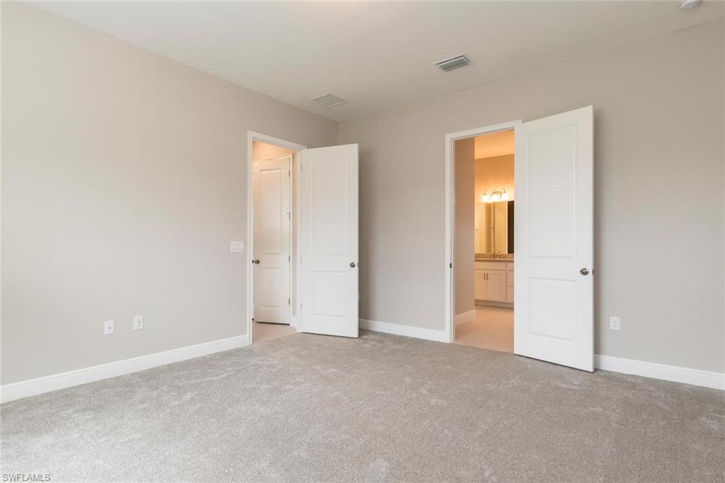 3509 Pilot Circle Naples, FL 34120 - Photo 17 of 32 a view of an empty room and closet area