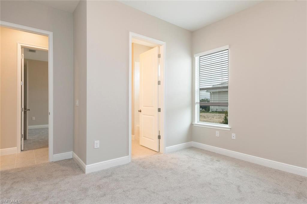 3509 Pilot Circle Naples, FL 34120 - Photo 21 of 32 an empty room with windows
