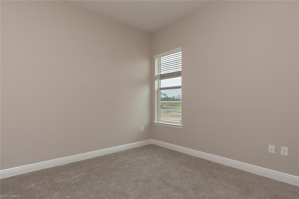 3509 Pilot Circle Naples, FL 34120 - Photo 23 of 32 an empty room with a window