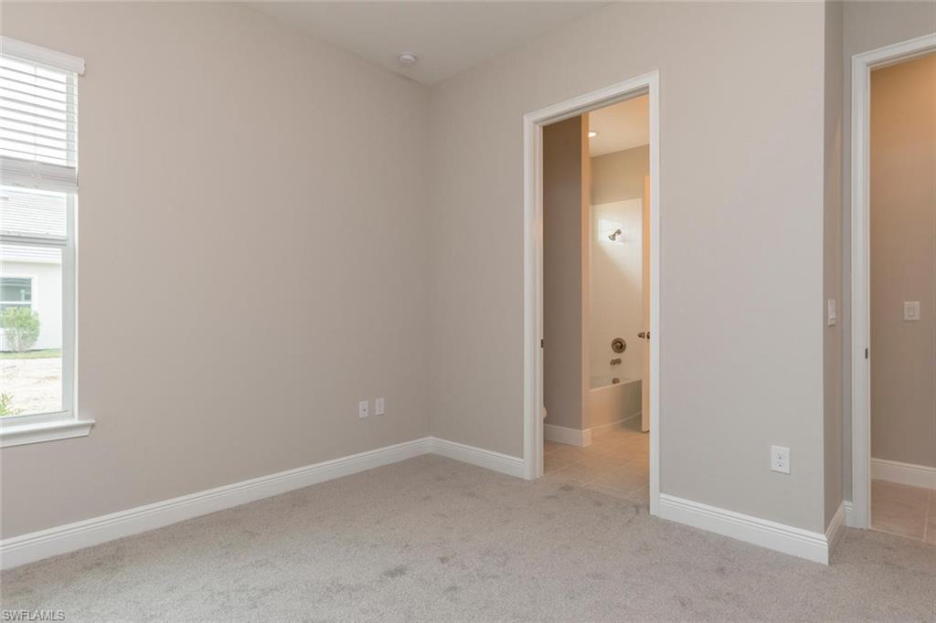 3509 Pilot Circle Naples, FL 34120 - Photo 24 of 32 an empty room with windows and closet