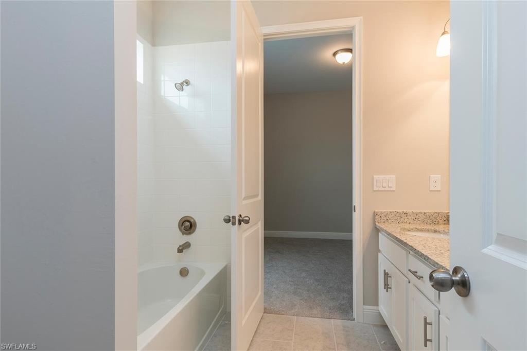 3509 Pilot Circle Naples, FL 34120 - Photo 25 of 32 a bathroom with a bathtub and shower