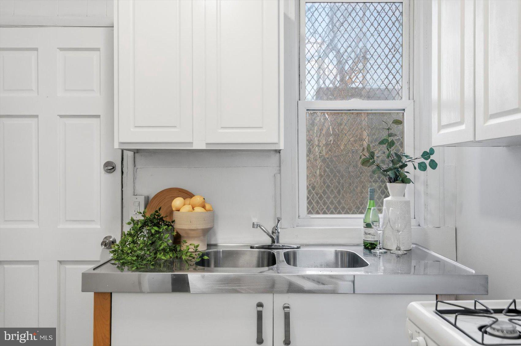 1017 Sterrett Street Baltimore, MD 21230 - Photo 12 of 29 a bathroom with a sink and a mirror