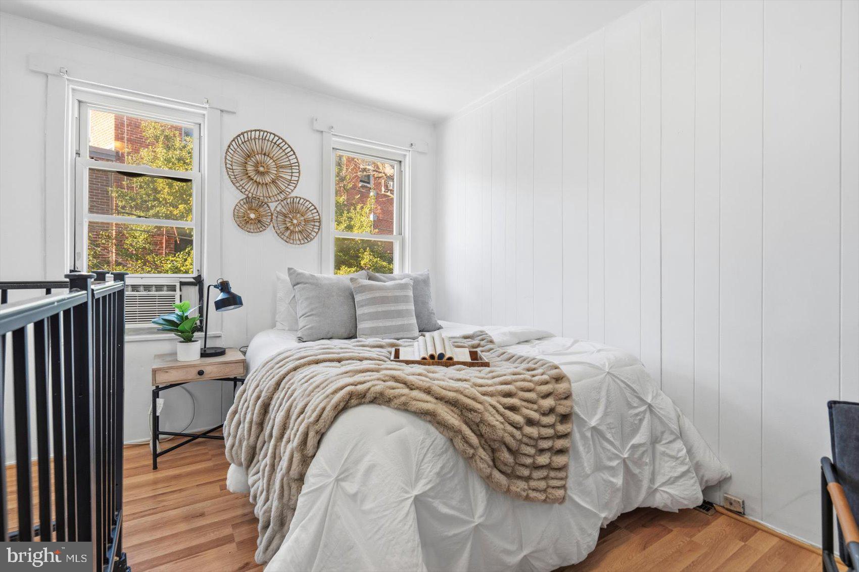 1017 Sterrett Street Baltimore, MD 21230 - Photo 13 of 29 a bed sitting in a bedroom next to a window