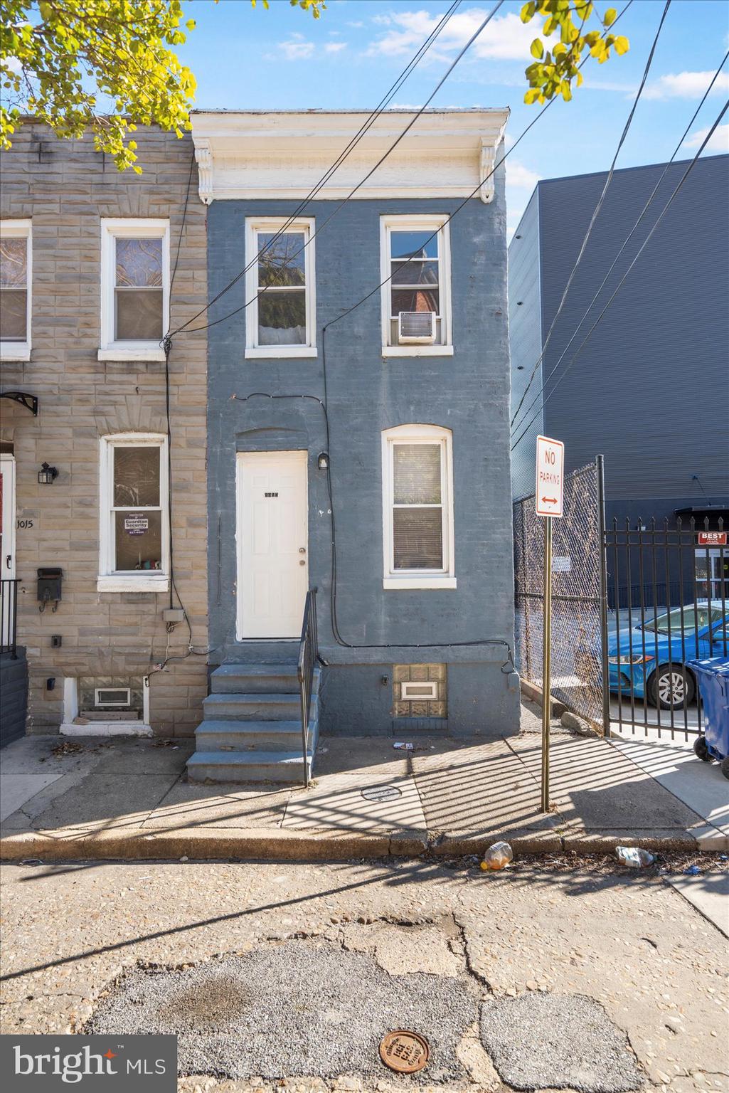 1017 Sterrett Street Baltimore, MD 21230 - Photo 2 of 29 a front view of a building with street view