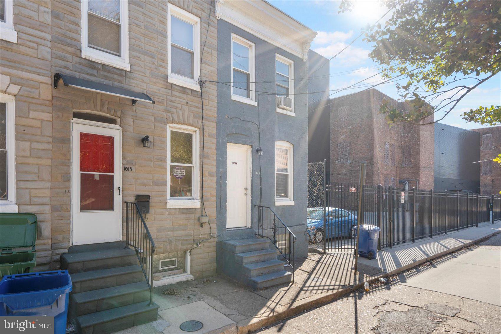 1017 Sterrett Street Baltimore, MD 21230 - Photo 28 of 29 a view of a patio with couches table and chairs and potted plants